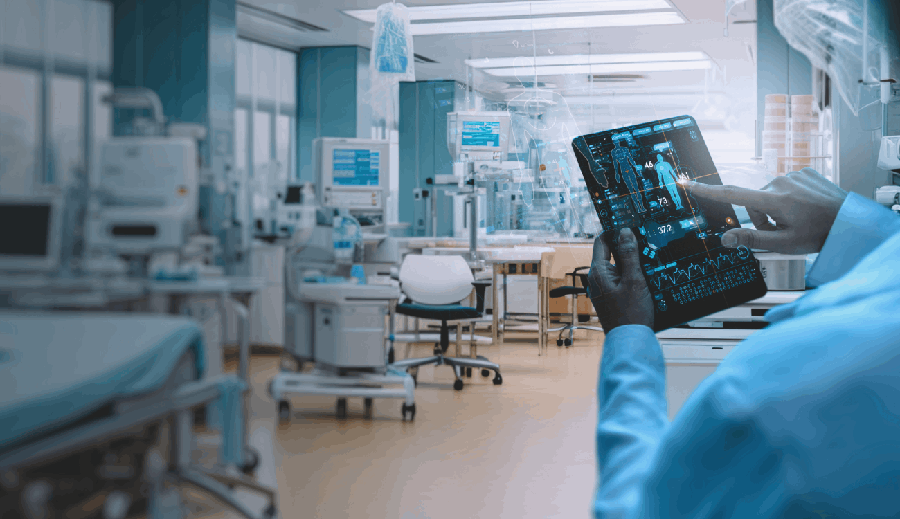 A person in a health science lab holding a tablet which is displaying information about a human body.