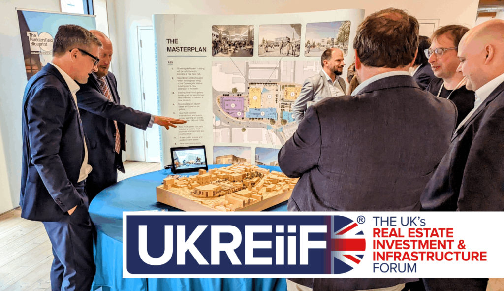 People stood around a project showcase at UKREiiF