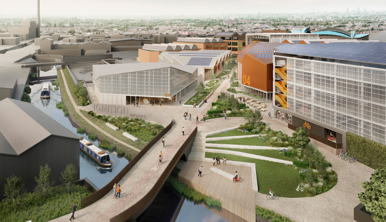 Image shows Artist Impressions of Ignition Works site (for illustrative purposes only) from architects Bond Bryan: Fairhursts. Image shows buildings, canal with a barge on it, green grassed ares and people walking accross the footbridge.